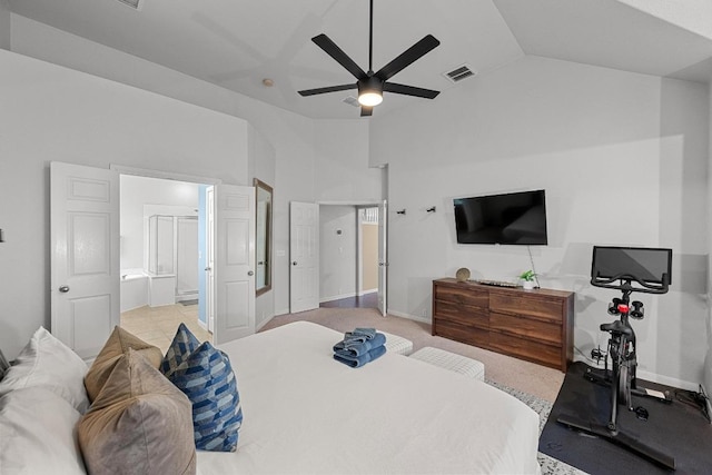 bedroom with vaulted ceiling, visible vents, connected bathroom, baseboards, and ceiling fan