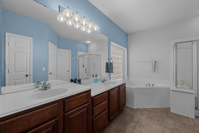 full bath featuring a bath, a sink, a shower stall, and double vanity