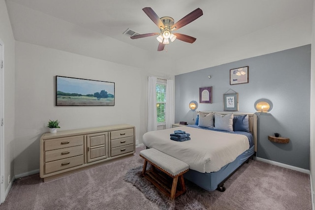 carpeted bedroom featuring visible vents, baseboards, and ceiling fan