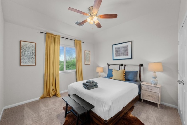 bedroom featuring carpet floors, a ceiling fan, visible vents, and baseboards