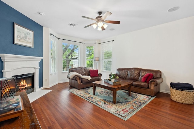 3614 Turkey Path Bnd, Cedar Park, TX 78613 - living room with a ceiling fan, wood finished floors, and a lit fireplace
