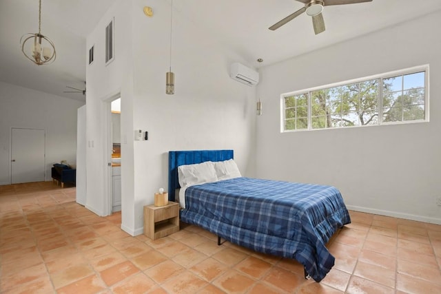 bedroom featuring visible vents, an AC wall unit, light tile patterned floors, baseboards, and ceiling fan