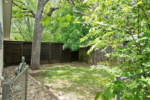 view of yard with a fenced backyard