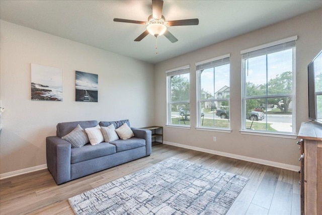 943 Lone Peak Way, Dripping Springs, TX 78620 - living area featuring healthy amount of natural light, light wood-style floors, and baseboards