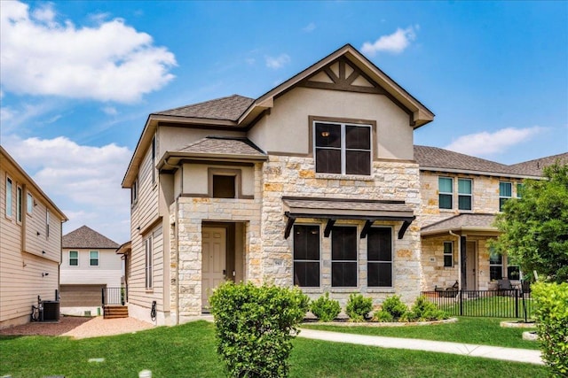 943 Lone Peak Way, Dripping Springs, TX 78620 - view of front of property with stone siding, stucco siding, roof with shingles, and central AC unit
