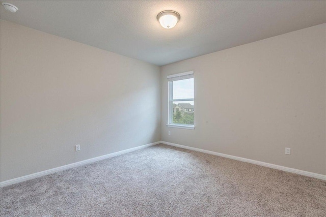943 Lone Peak Way, Dripping Springs, TX 78620 - carpeted spare room with a smoke detector and baseboards