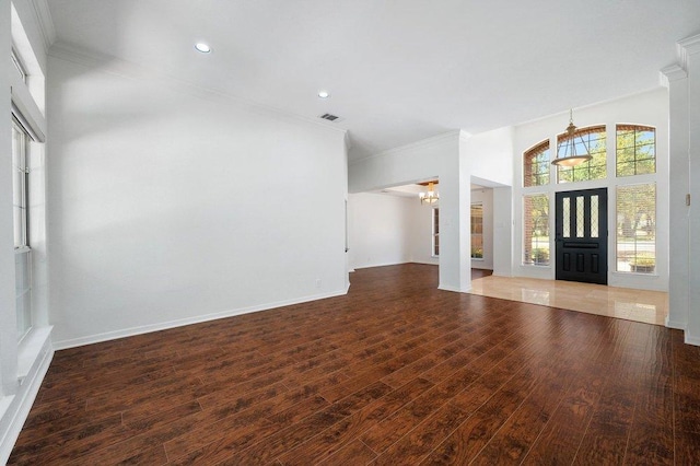 entrance foyer with baseboards, wood finished floors, recessed lighting, and crown molding