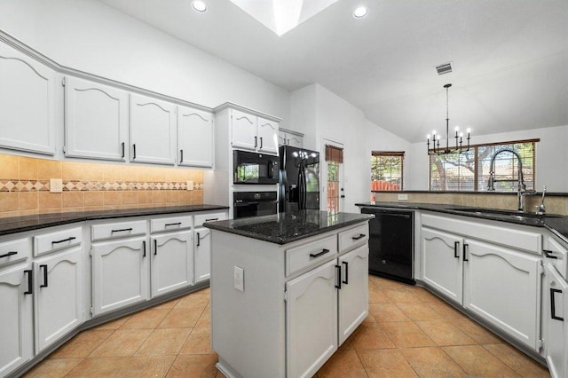 kitchen with a sink, black appliances, an inviting chandelier, backsplash, and lofted ceiling