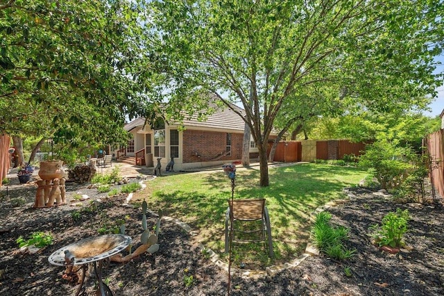 209 El Rio Dr, Lakeway, TX 78734 - fenced backyard featuring a patio