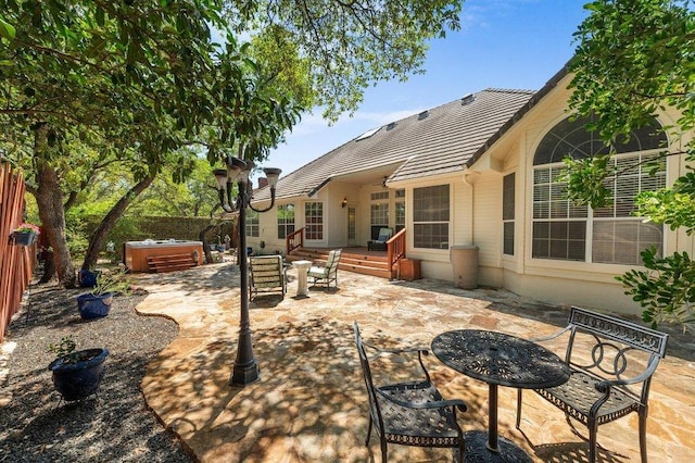 209 El Rio Dr, Lakeway, TX 78734 - view of patio / terrace featuring a hot tub and an outdoor fire pit