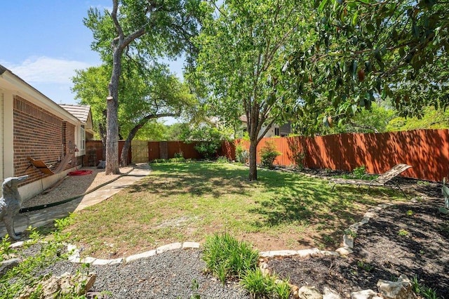 view of yard featuring a fenced backyard