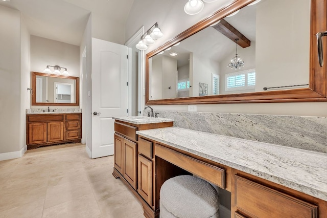 1113 Lions Lair, Leander, TX 78641 - bathroom featuring two vanities, a chandelier, and tile patterned floors