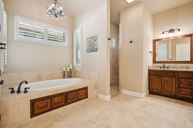 1113 Lions Lair, Leander, TX 78641 - bathroom featuring a bath, a walk in shower, vanity, and a chandelier