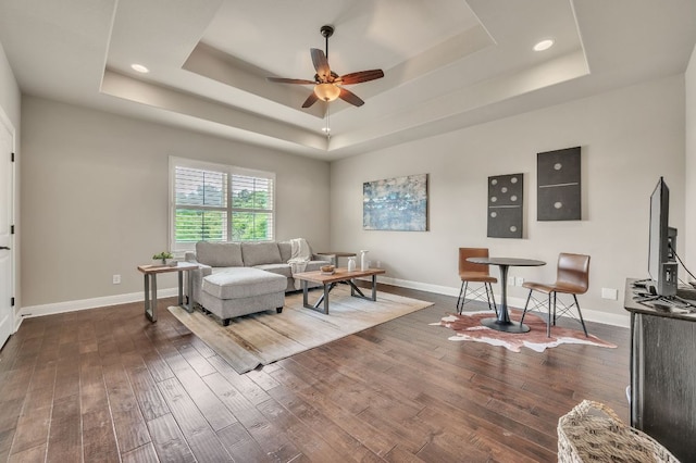 1113 Lions Lair, Leander, TX 78641 - living room with a tray ceiling, a ceiling fan, dark wood-style floors, and recessed lighting