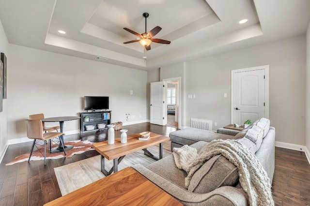 1113 Lions Lair, Leander, TX 78641 - living area featuring a raised ceiling, ceiling fan, dark wood-type flooring, and recessed lighting