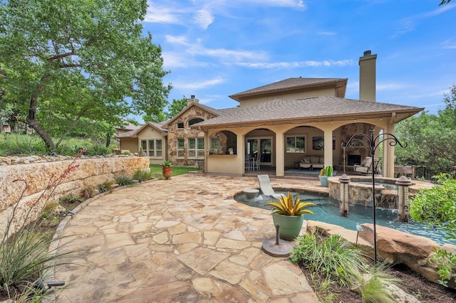 1113 Lions Lair, Leander, TX 78641 - back of house featuring a patio and an outdoor hangout area
