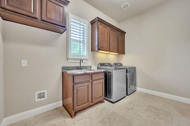 1113 Lions Lair, Leander, TX 78641 - laundry room featuring cabinet space and washing machine and clothes dryer