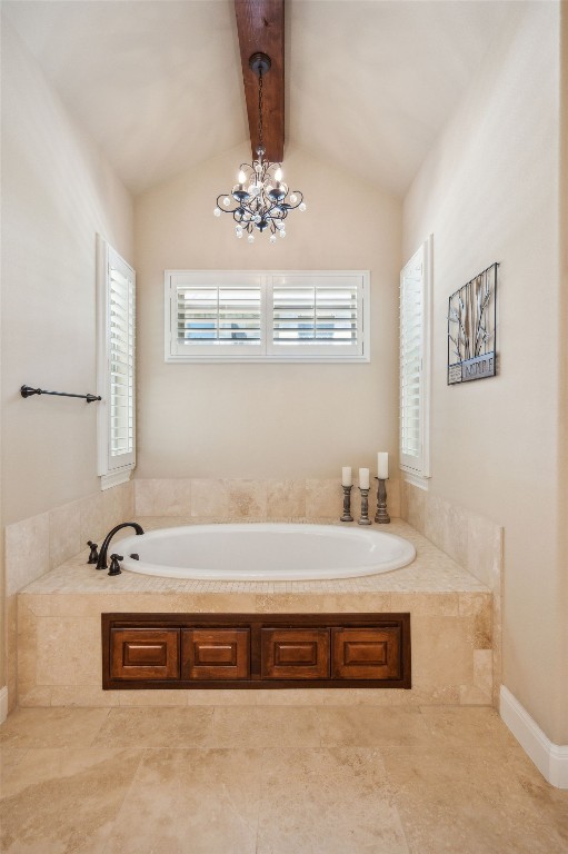 1113 Lions Lair, Leander, TX 78641 - bathroom with a garden tub and a chandelier