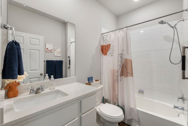full bath featuring shower / tub combo, vanity, and toilet