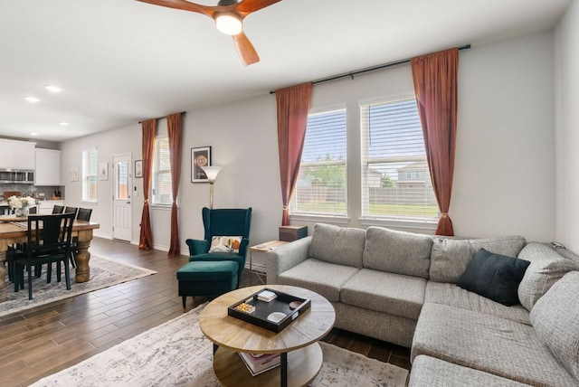 living room featuring recessed lighting, dark wood finished floors, and a ceiling fan