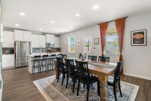 dining space featuring dark wood-type flooring, visible vents, baseboards, and recessed lighting