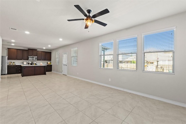 8060 Massa Dr, Round Rock, TX 78665 - unfurnished living room featuring recessed lighting, ceiling fan, and light tile patterned floors