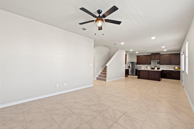 8060 Massa Dr, Round Rock, TX 78665 - unfurnished living room with recessed lighting, stairs, and ceiling fan