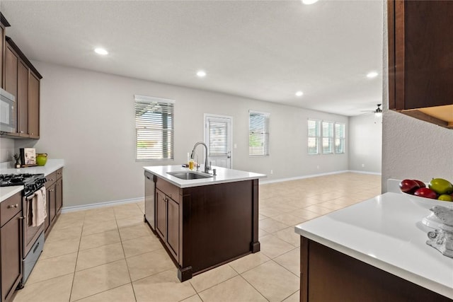 8060 Massa Dr, Round Rock, TX 78665 - kitchen featuring range with gas cooktop, light tile patterned flooring, stainless steel dishwasher, light countertops, and recessed lighting