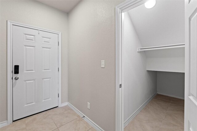 8060 Massa Dr, Round Rock, TX 78665 - hallway with light tile patterned flooring and baseboards