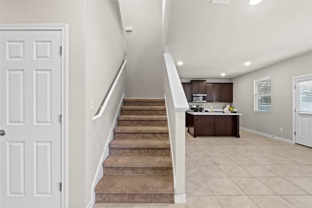 8060 Massa Dr, Round Rock, TX 78665 - stairs featuring recessed lighting and tile patterned floors