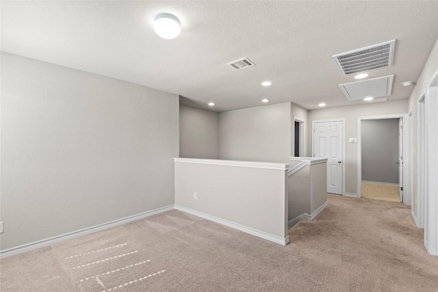 8060 Massa Dr, Round Rock, TX 78665 - empty room featuring light colored carpet and attic access