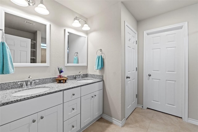 8060 Massa Dr, Round Rock, TX 78665 - full bath with double vanity and tile patterned floors