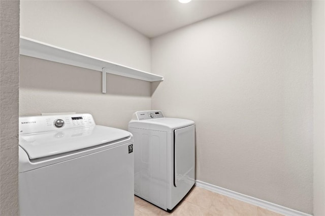 8060 Massa Dr, Round Rock, TX 78665 - laundry room with independent washer and dryer and light tile patterned floors