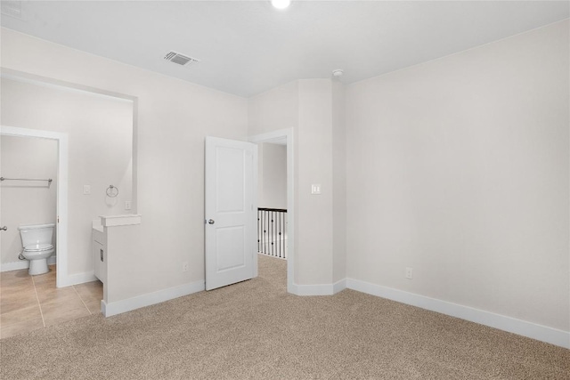 101 Golden Sage Ave, Georgetown, TX 78633 - unfurnished bedroom featuring light carpet and ensuite bath