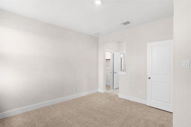 unfurnished bedroom featuring visible vents, baseboards, recessed lighting, and light colored carpet