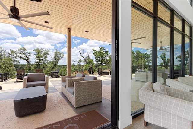view of patio / terrace with an outdoor living space and ceiling fan