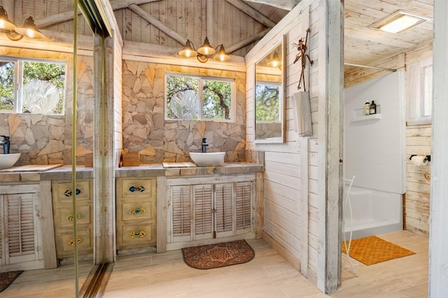 interior space featuring wooden ceiling and a sink