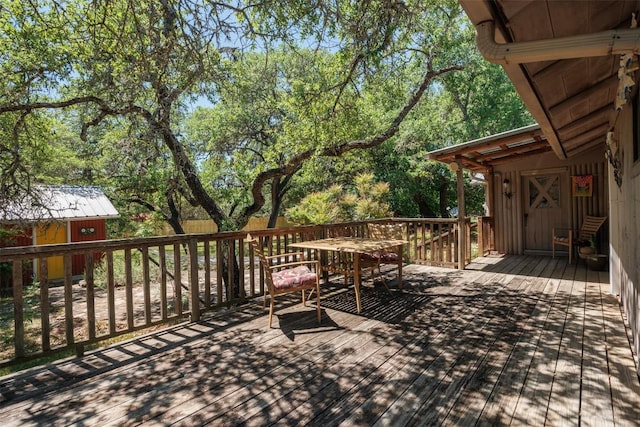 wooden deck featuring an outbuilding
