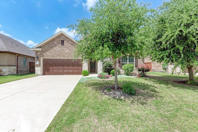 4228 Hannover Way, Round Rock, TX 78681 - view of front of house featuring concrete driveway, an attached garage, brick siding, and a front yard