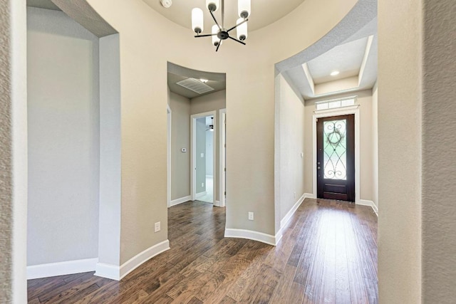 4228 Hannover Way, Round Rock, TX 78681 - foyer featuring a chandelier, dark wood-style flooring, and a tray ceiling