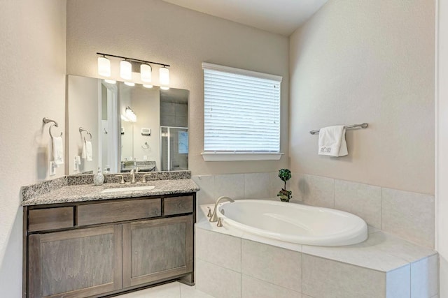4228 Hannover Way, Round Rock, TX 78681 - full bath with a garden tub, vanity, and a shower stall