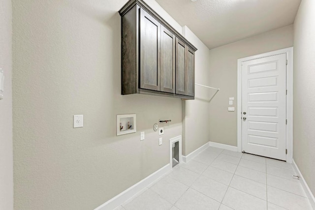 4228 Hannover Way, Round Rock, TX 78681 - laundry room with hookup for an electric dryer, gas dryer hookup, hookup for a washing machine, baseboards, and cabinet space