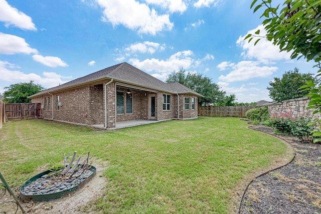 4228 Hannover Way, Round Rock, TX 78681 - rear view of house with brick siding, a patio area, and a fenced backyard