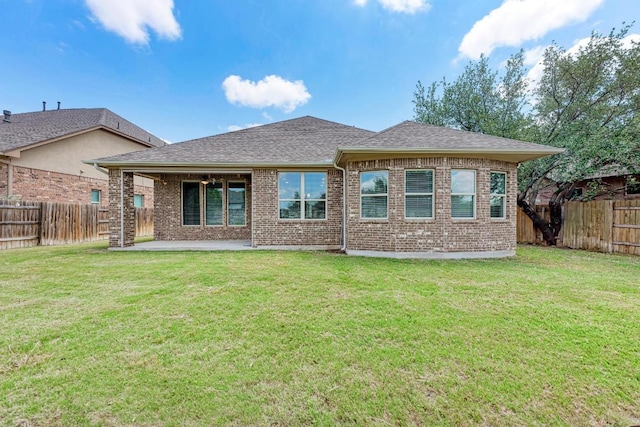 4228 Hannover Way, Round Rock, TX 78681 - rear view of house with a fenced backyard, brick siding, and a patio area