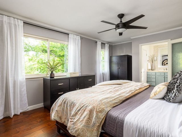 9200 Collingwood Dr, Austin, TX 78748 - bedroom featuring dark wood-style floors, baseboards, crown molding, a ceiling fan, and ensuite bath