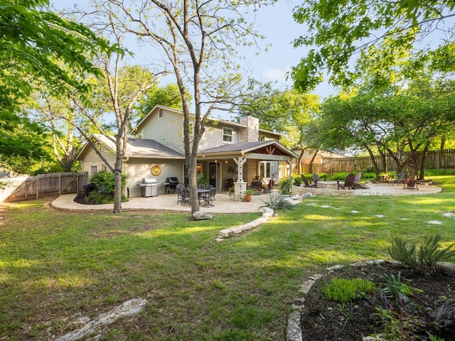 9200 Collingwood Dr, Austin, TX 78748 - rear view of property featuring a chimney and a patio area
