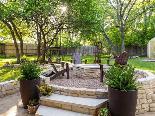 9200 Collingwood Dr, Austin, TX 78748 - view of patio featuring a fire pit