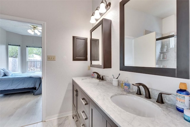 3100 Jubilee Trl, Austin, TX 78748 - ensuite bathroom with double vanity, ceiling fan, baseboards, and marble finish flooring