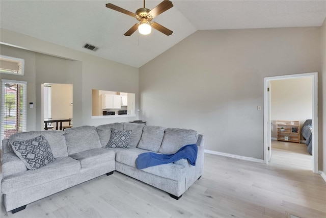 3100 Jubilee Trl, Austin, TX 78748 - living area with high vaulted ceiling, light wood-style floors, ceiling fan, and baseboards