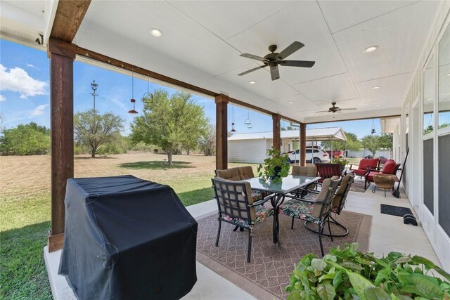 view of patio / terrace featuring an outdoor living space, grilling area, ceiling fan, and outdoor dining space